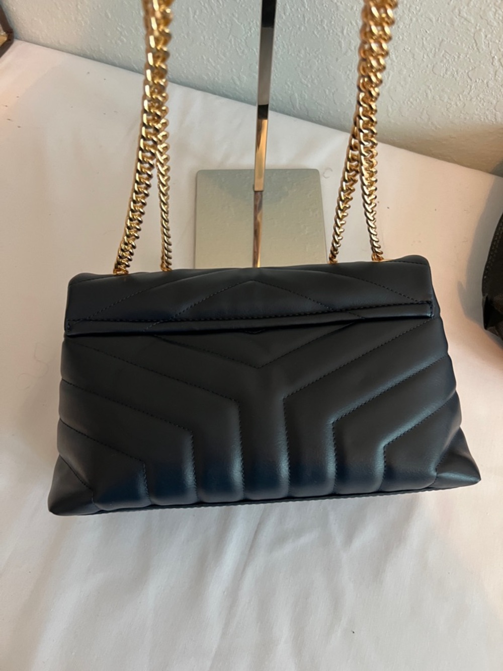 Yves Saint Laurent Navy Blue with gold tone chain and emblem. - Picture 7 of 11
